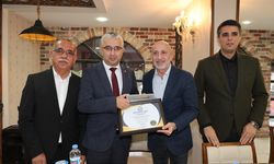 Başkan Erkan Gürbüz’e “Hizmet Dalı Ödülü”