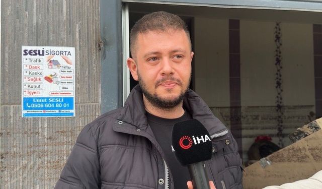 Sel sularında mahsur kalan anne kedi ve yavrularını esnaf kurtardı